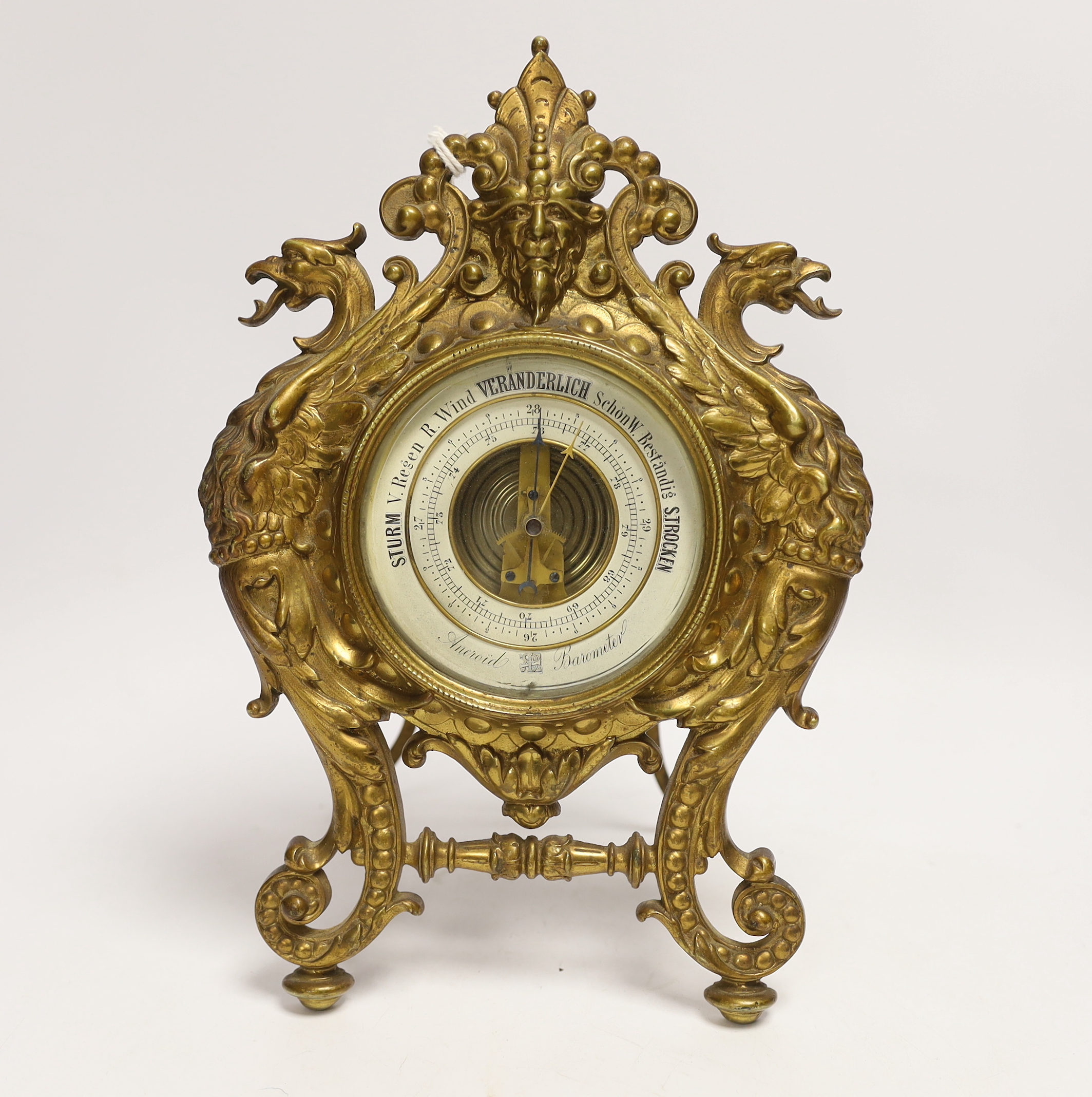 A German cast brass easel aneroid barometer, c.1883, 28cm high